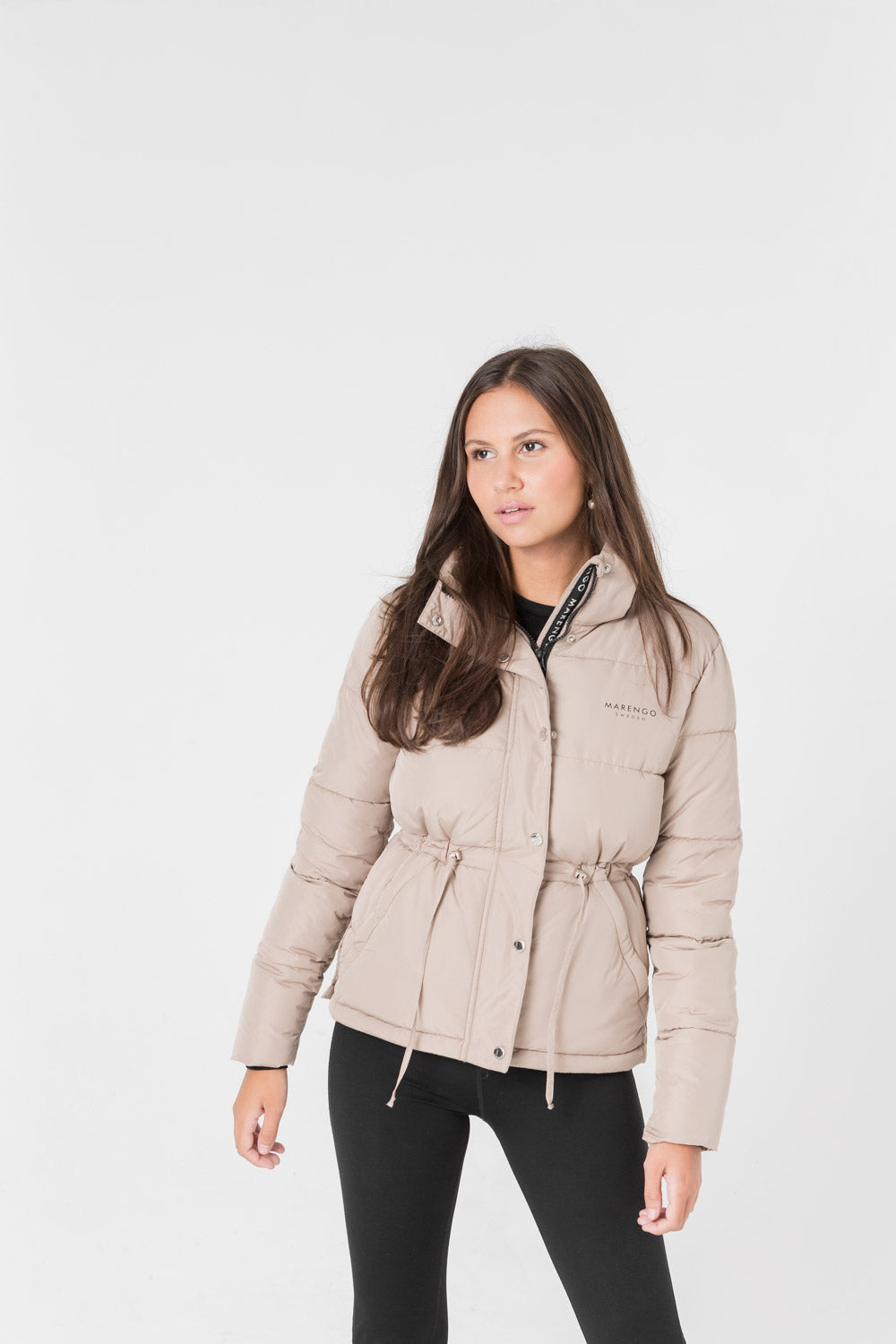 Beige padded jacket front pose