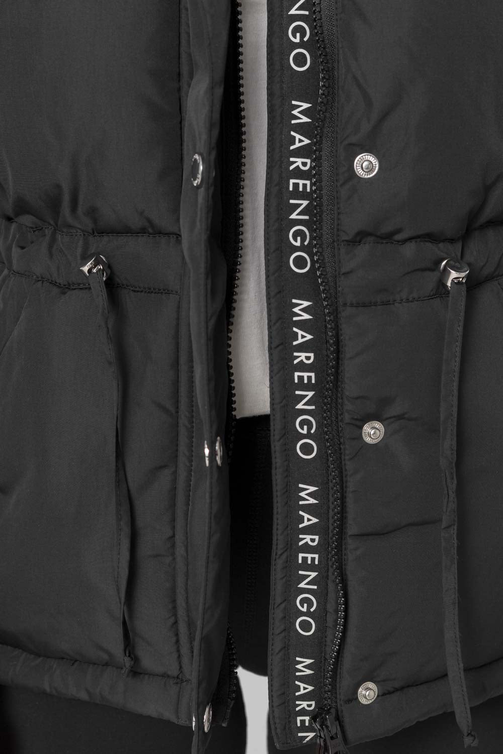 Black padded jacket zipper detail
